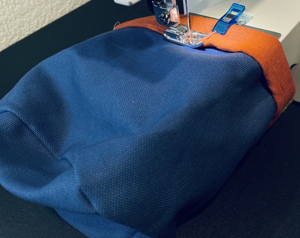 Stitch around the bottom of the fold and sew down the hem.