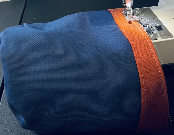 Sew a top stitch around the top just below the top 1/8” from the edge.