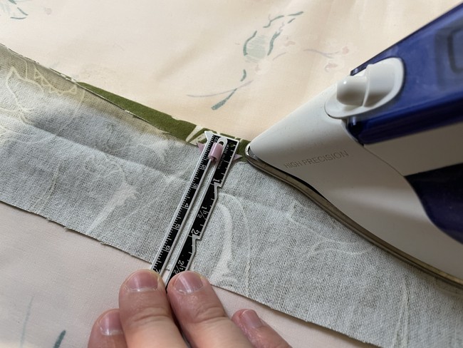 Fold the casing piece in half lengthwise wrong sides facing. Then fold each side in again about 1/4”