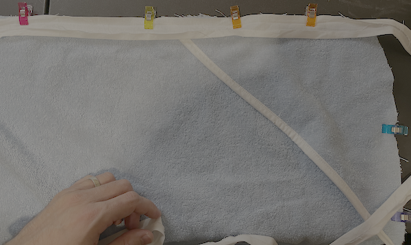 Repeat the same process for attaching the bias as you did with the hood.