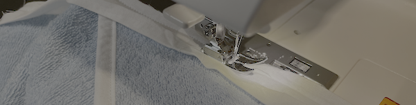 Then sew the bias down to the towel with about a 1/4”-3/8” seam allowance