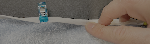 Fold the bias back over and wrap it over to the opposite side of the towel.