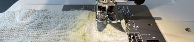 Pivot at the corner, leave the needle down, lift the foot and turn the fabric.