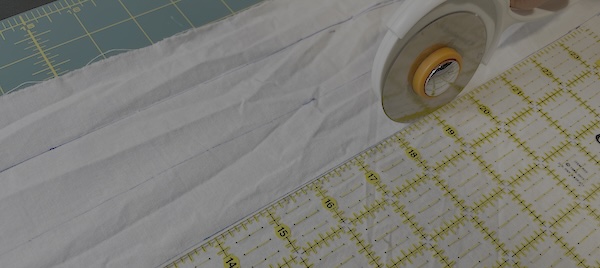 Cut out your bias fabric. Be sure to iron out the fabric as flat as possible so the length is consistent.