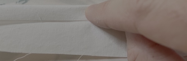 Fold one long side in to this middle crease. Iron this down.