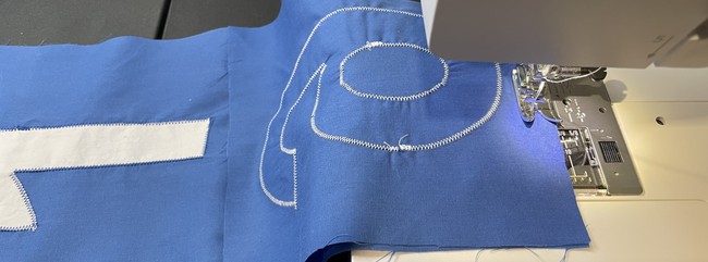 Place the next square on the right-most square on the indicated side, again right sides facing. Stitch with a 1/4” seam allowance