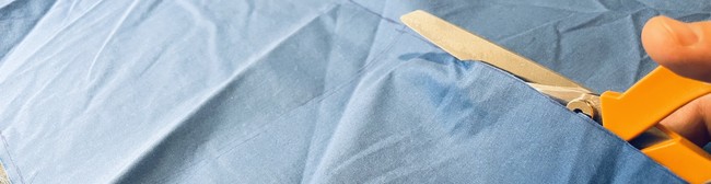 Cutting out the six (6) squares with the following dimensions: 10” x 10”.