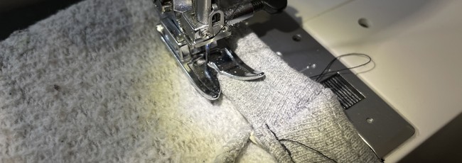 Leave a small gap at the end to use to feed the elastic through