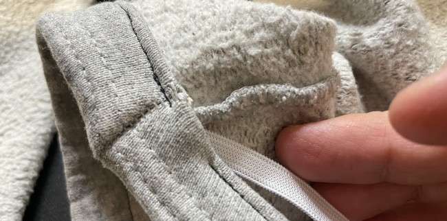 Feed your previously cut piece of elastic through the casing