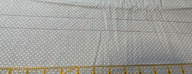 Measure out a strip about 42” long and 1.5” wide to be used for the bias strip around the edge