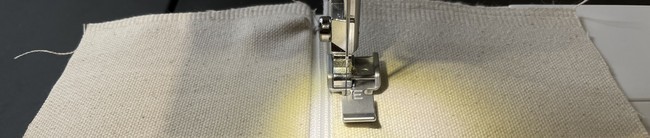 Top stitch along the two edges of the zipper