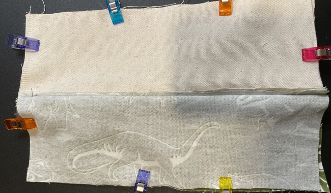 Once the top stitch is done, place the outer pieces together on one side of the zipper and the lining pieces together on the other side