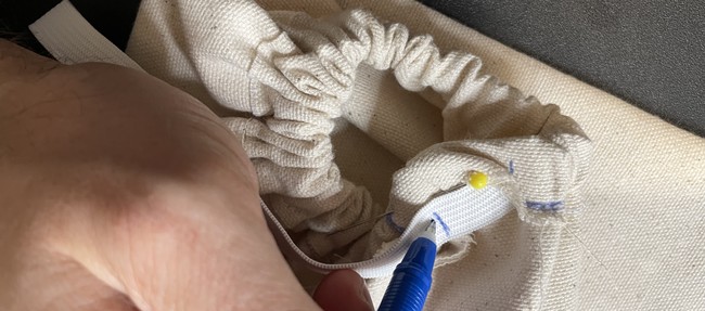 When you’ve found your ideal tightness mark the cross point on the exposed end of the elastic