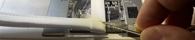 Fold in the edge at the opposite end and sew down