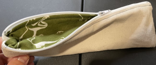 Stuff the lining inside the pouch