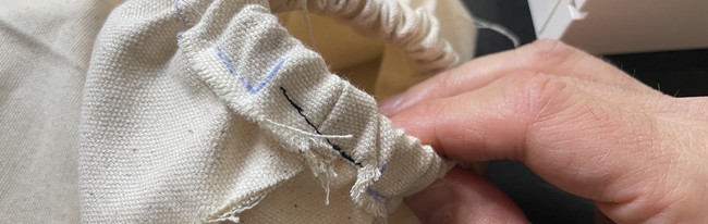 Stitch the opening shut and sew down the elastic to the main body