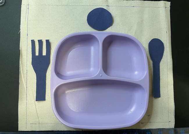 Place your shapes in the position that you want and pin it or use fabric glue them in place