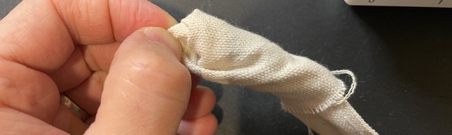 Turn the mystery bag strap right side out