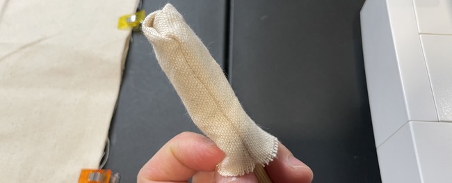 It helps to use something like a chopstick to push up the other end