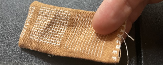 Ironed down tab piece