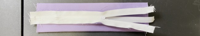 Insert the elastic strip inside the body of the pouch
