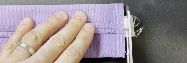 Trim the ends off the zipper