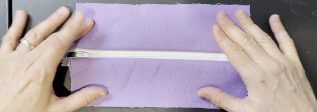 The two sides will look like this after being sewn to the zipper