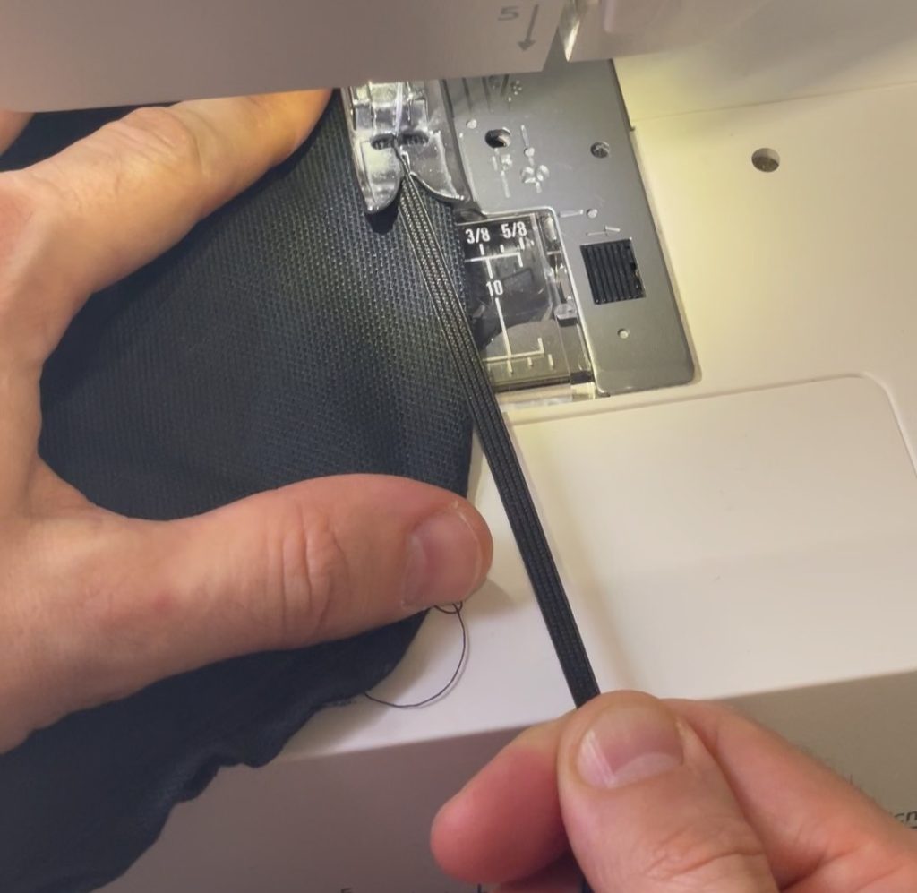 While pulling on the elastic, stitch around the edge of the cotton bowl cover using a zig zag stitch with a sub-1 stitch length 