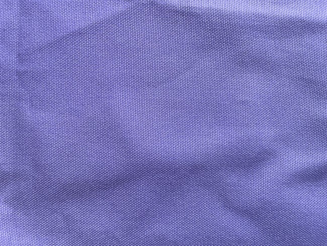 You can identify canvas by the heavier weight and rough texture