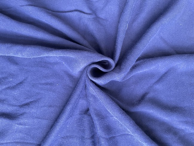 Jersey is a knit fabric (not woven) typically made from cotton or cotton/polyester blend. It is good for shirts or children's activewear