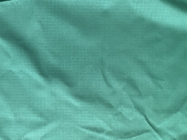 You can identify ripstop nylon by looking for the criss-cross markings